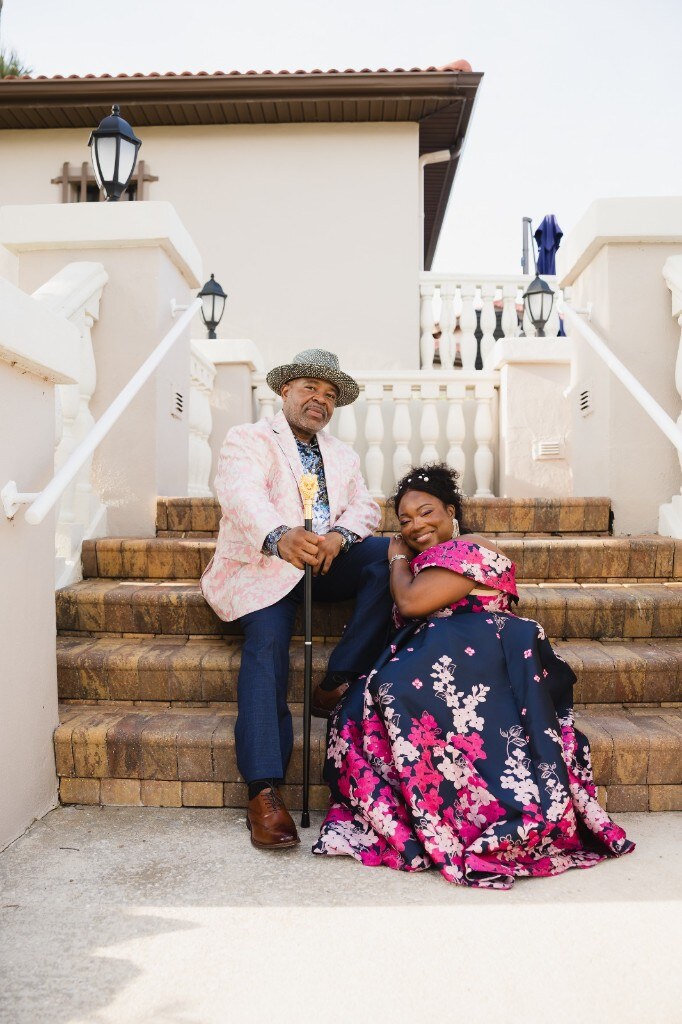 Seated together on the stone steps